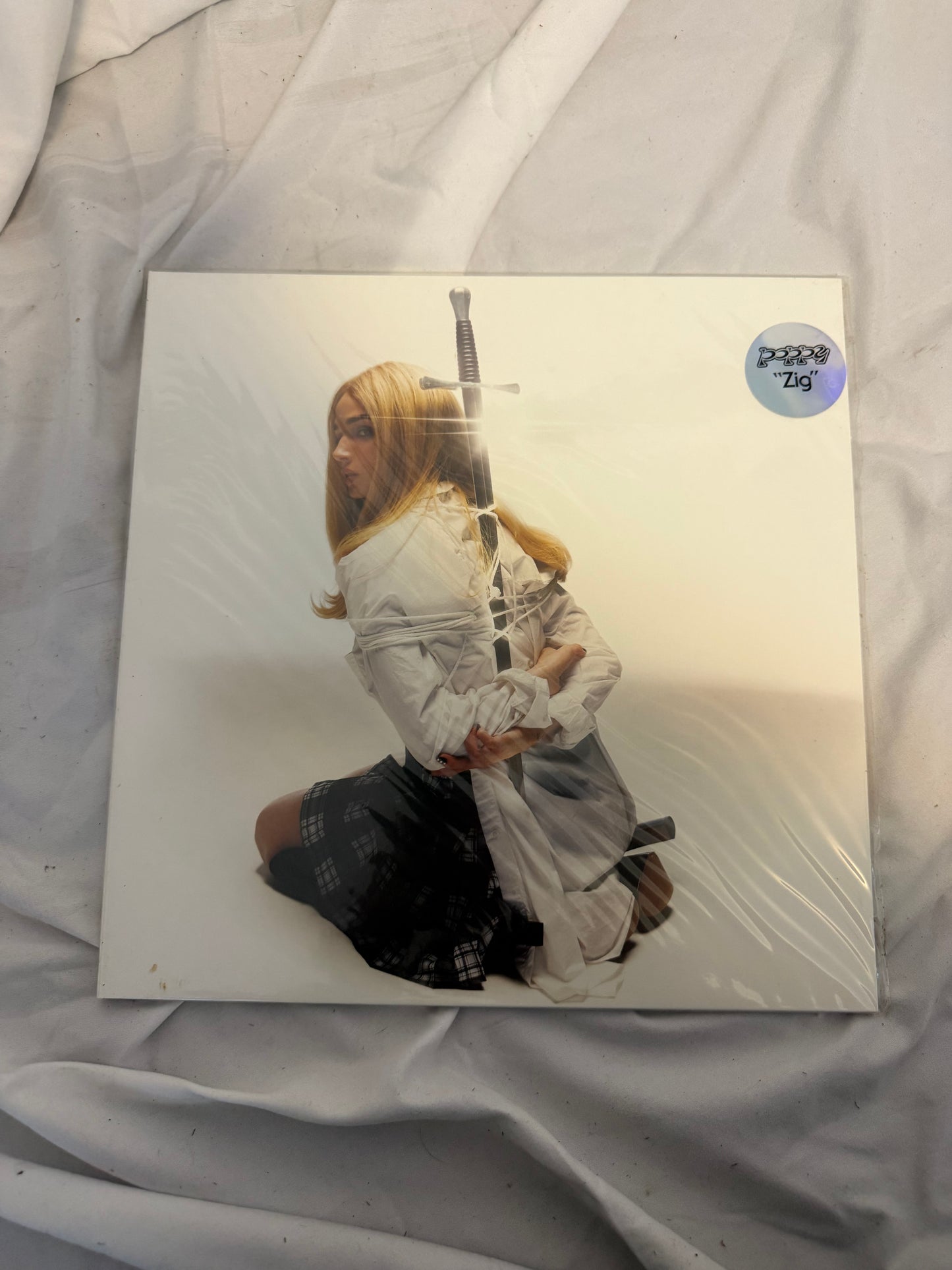 Poppy - Zig (Sumerian exclusive ultra clear/white split with purple splatter vinyl)