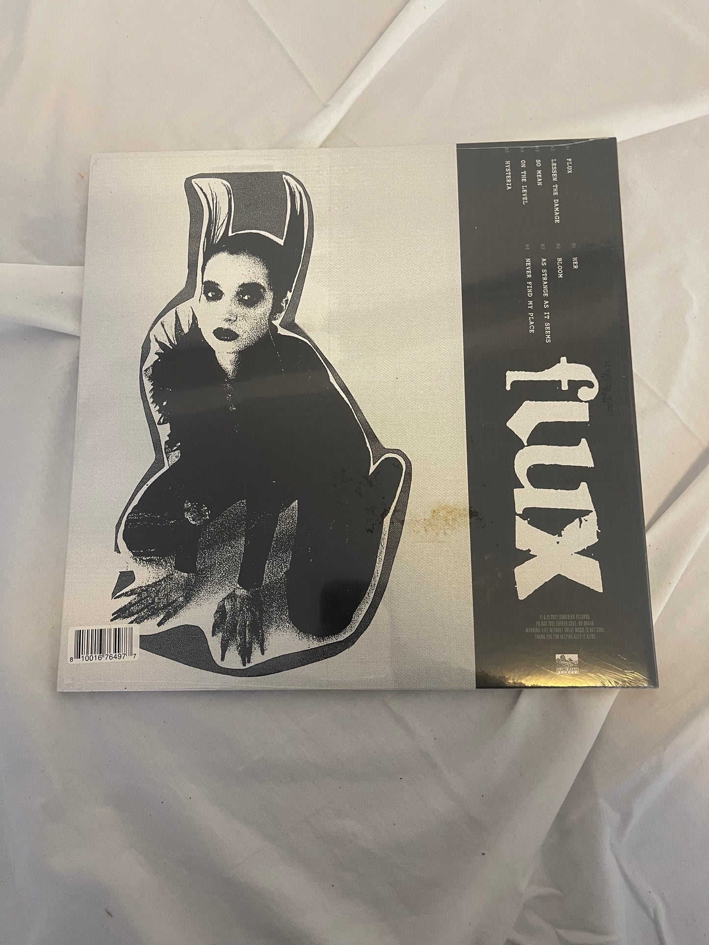 Poppy - Flux (Exclusive black inside aqua blue vinyl)