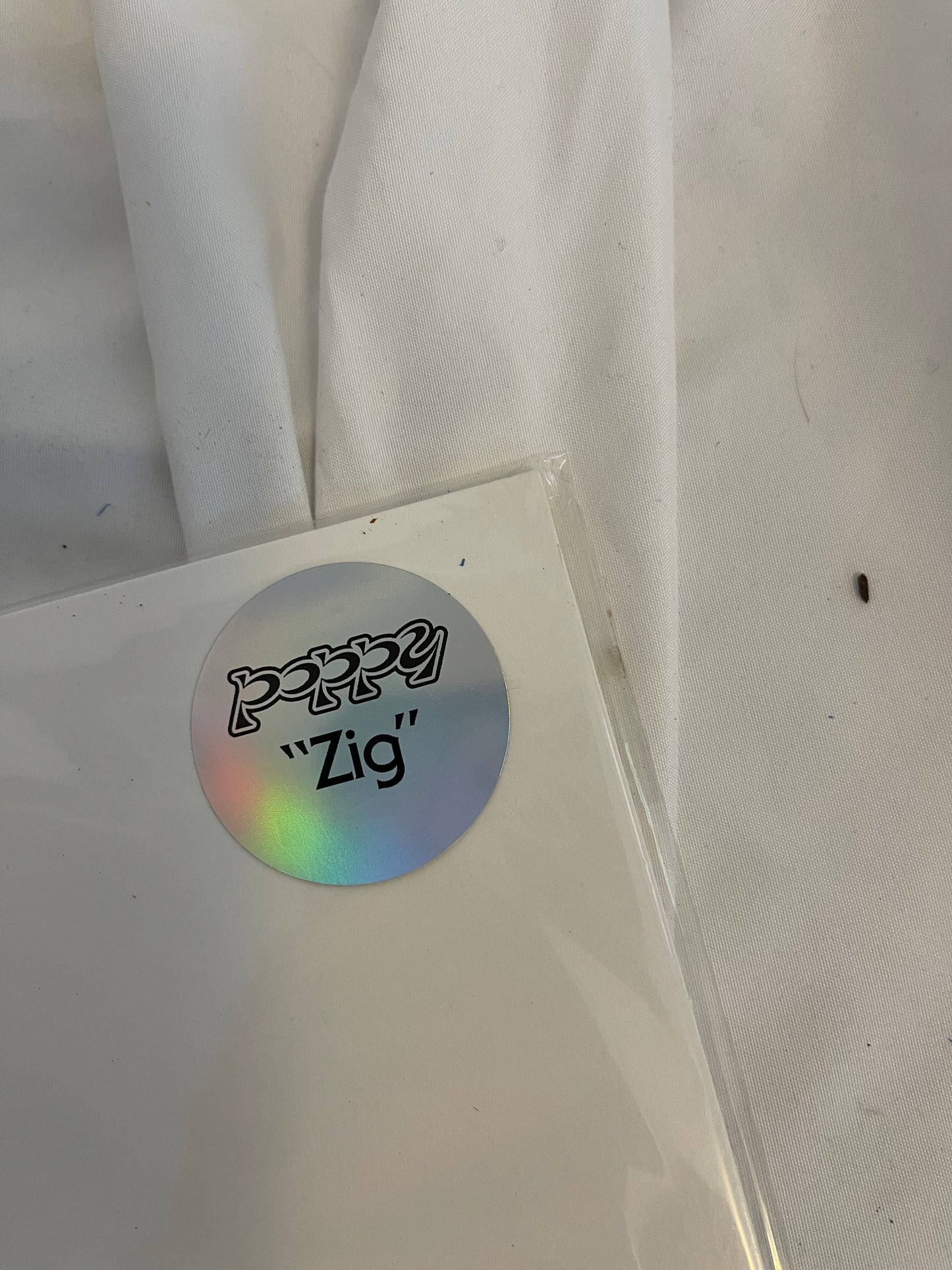 Poppy - Zig (Exclusive black inside transparent purple with heavy black splatter vinyl)