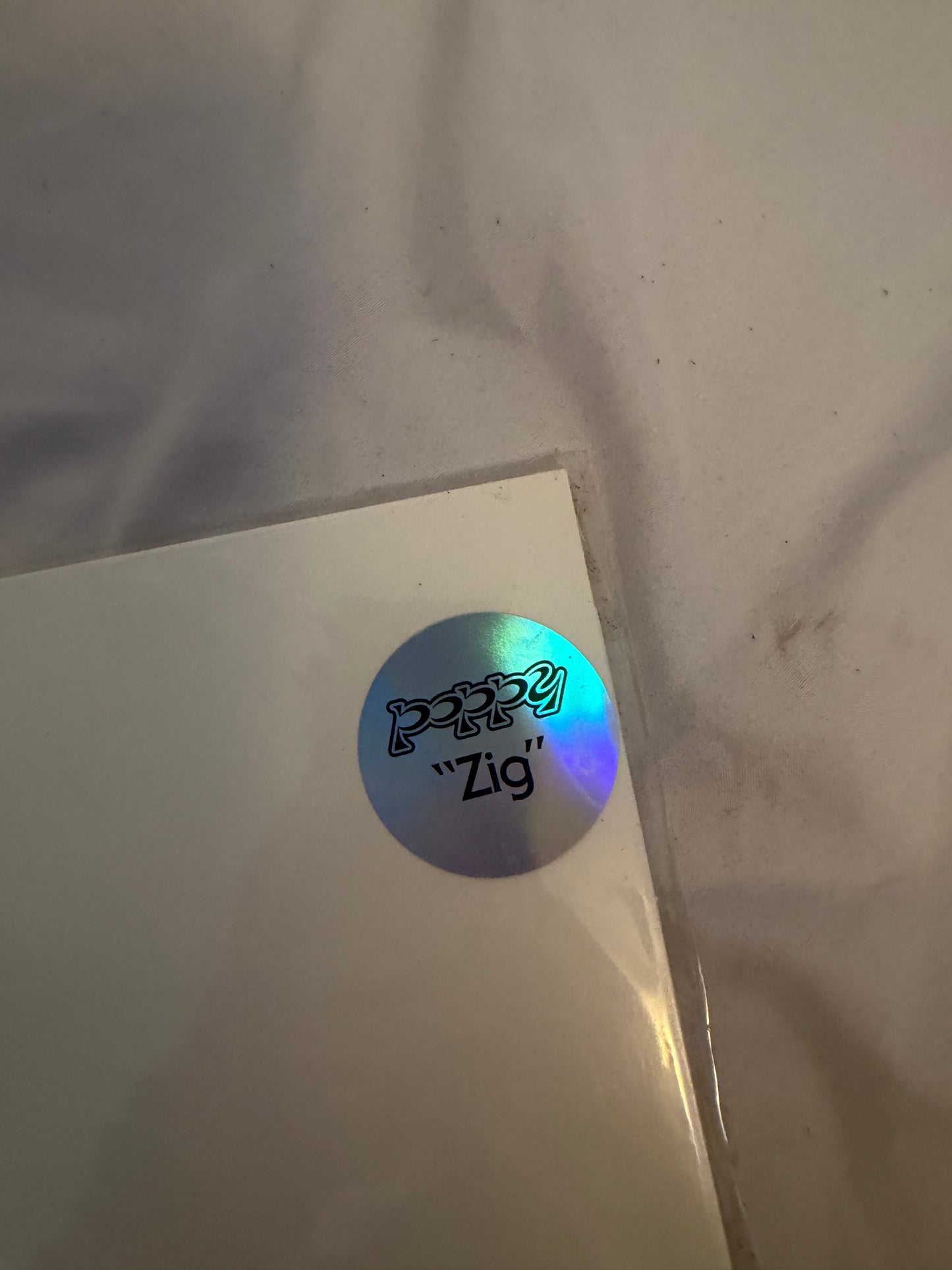 Poppy - Zig (Sumerian exclusive ultra clear/white split with purple splatter vinyl)