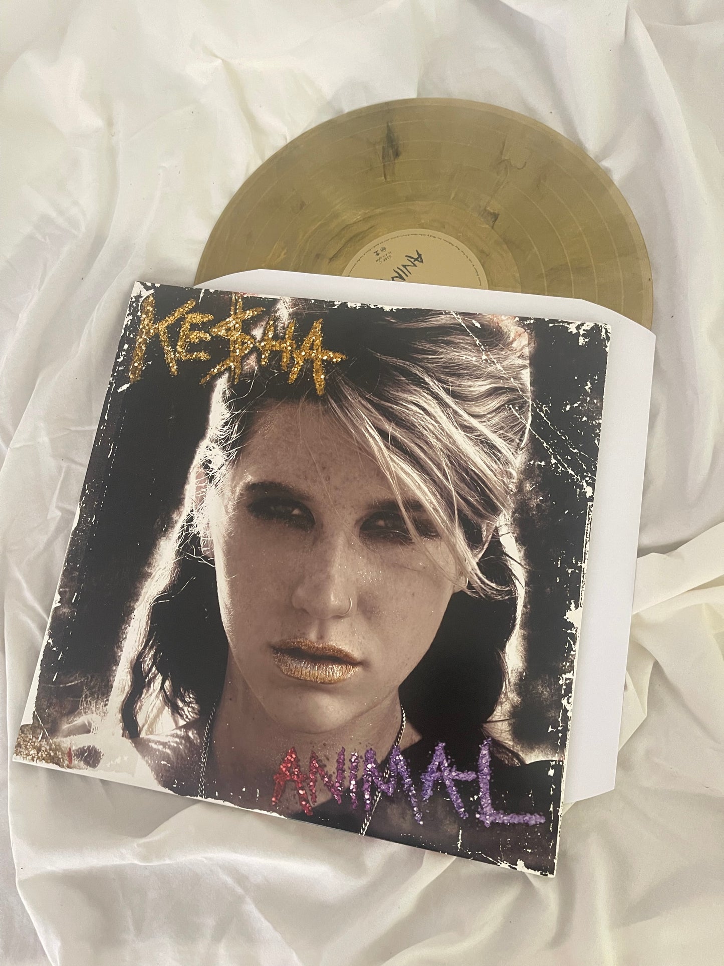 Kesha - Animal (Webstore exclusive clear with gold and black swirl vinyl)
