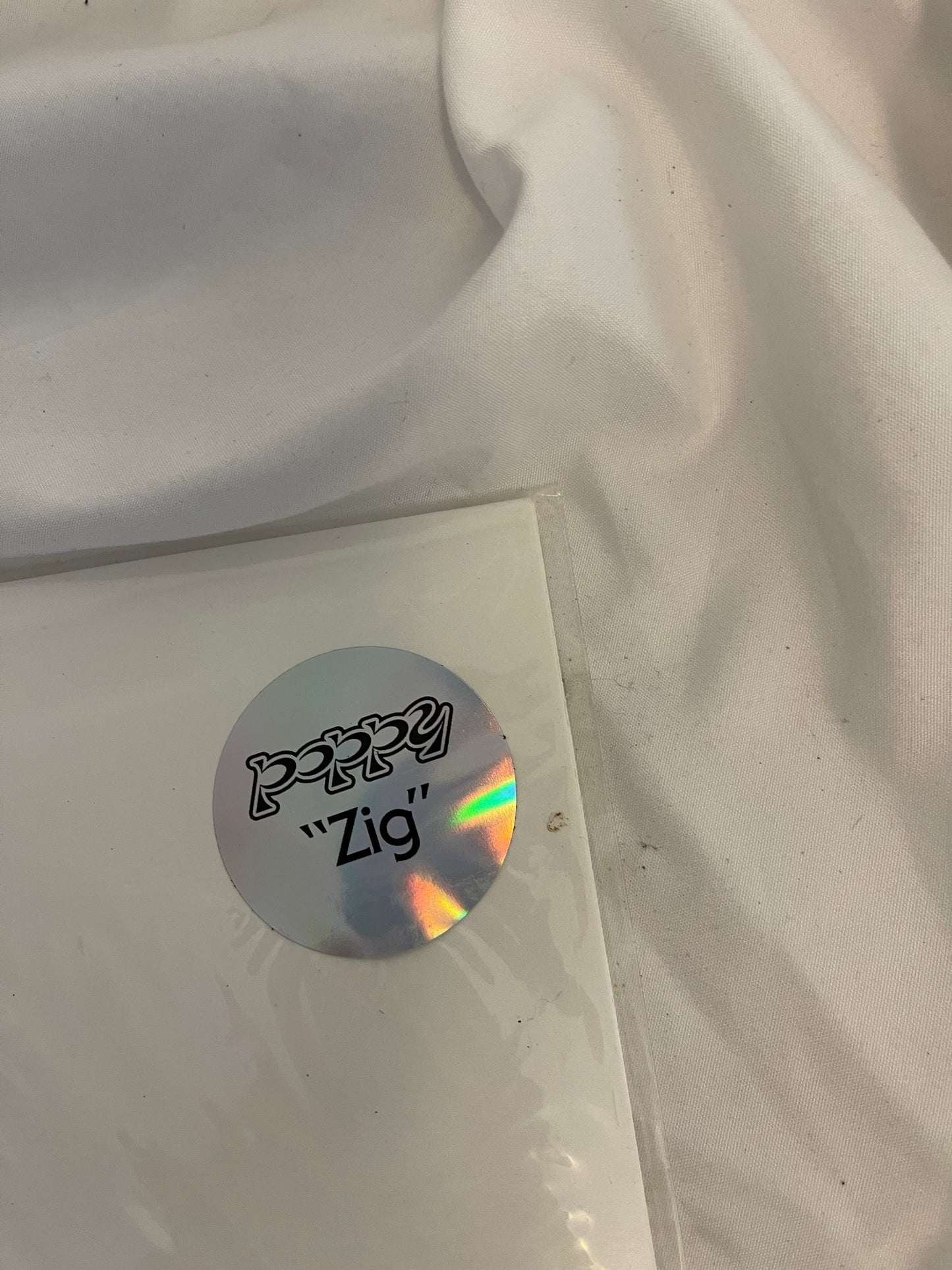 Poppy - Zig (Sumerian exclusive ultra clear/white split with purple splatter vinyl)