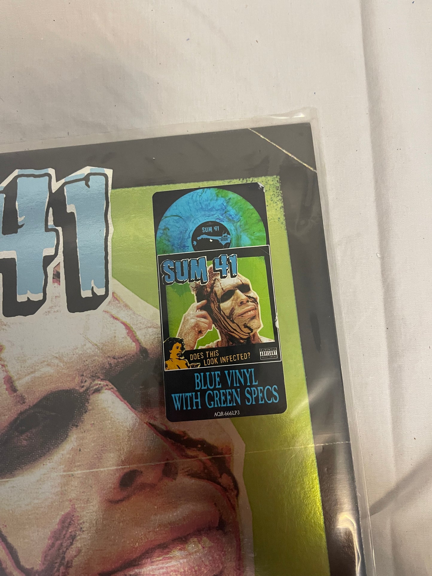 Sum 41 - Does This Look Infected? (Record Store Day Black Friday Canada exclusive Blue with green specs vinyl)