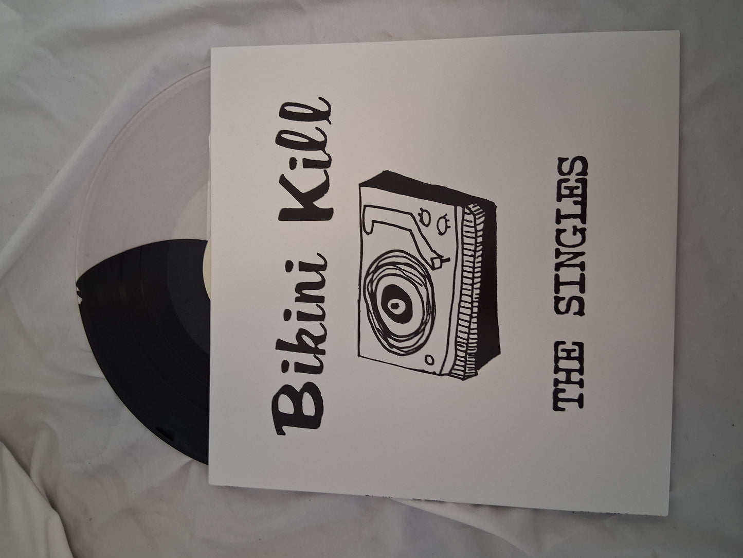Bikini Kill - The Singles (Newbury comics exclusive clear and black split vinyl)
